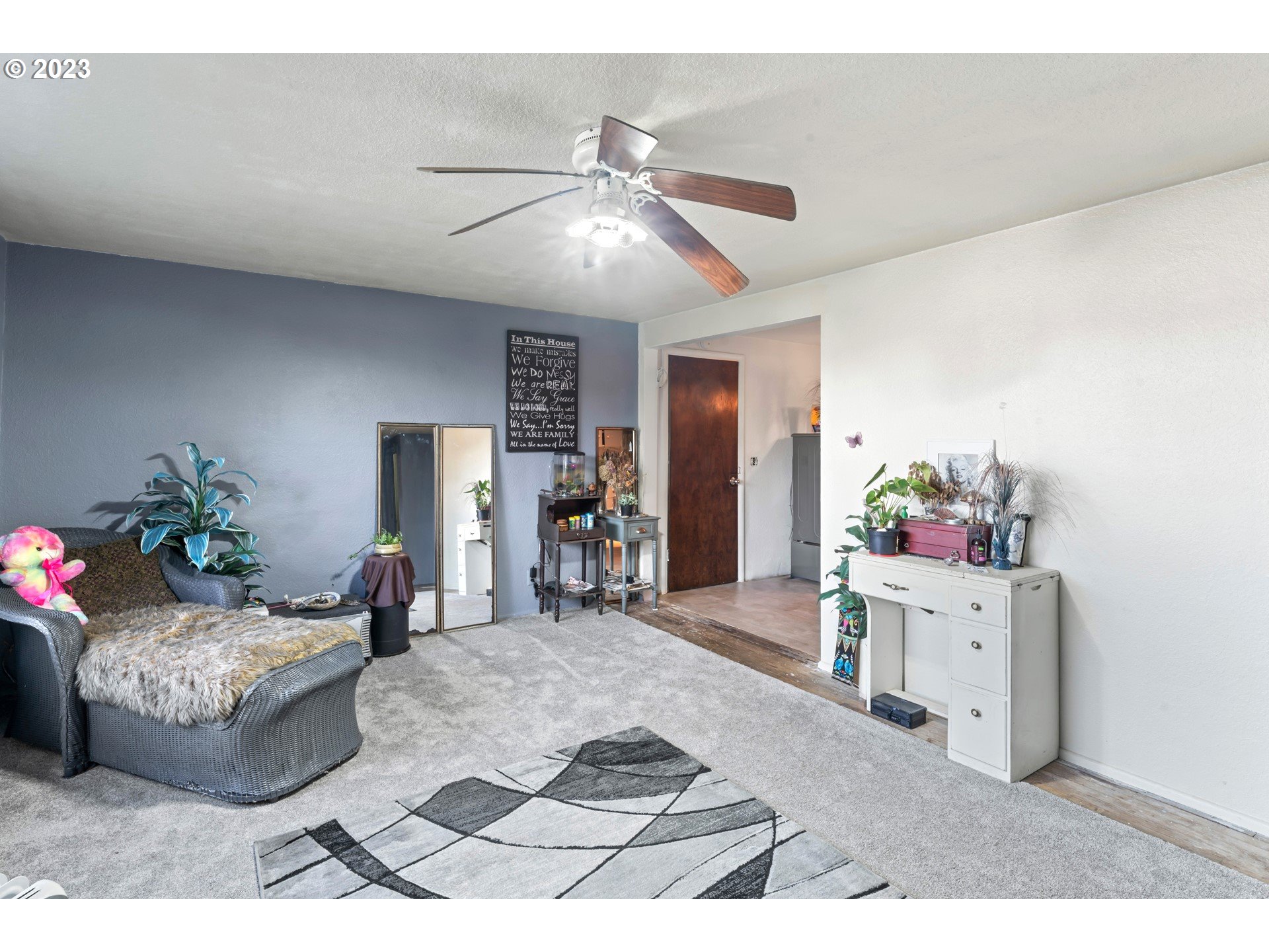 855 D Street Springfield, OR 97477 - Photo 5 of 18 a living room with furniture and a chandelier