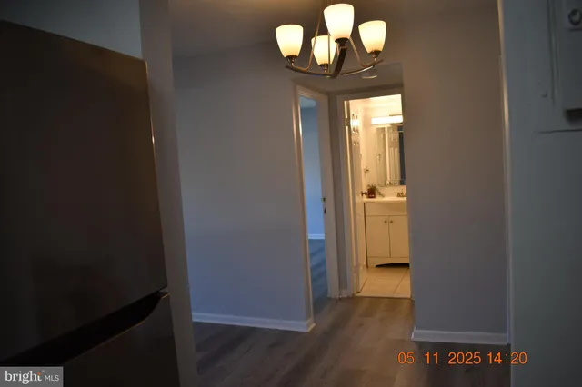 a bath room with a sink toilet and shower