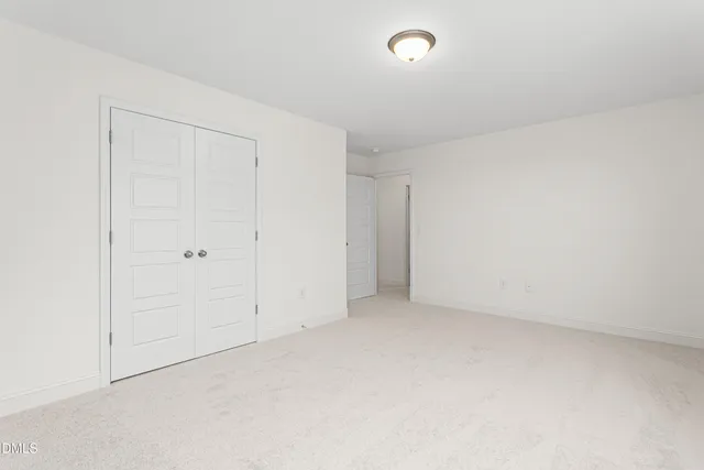 an empty room with white walls