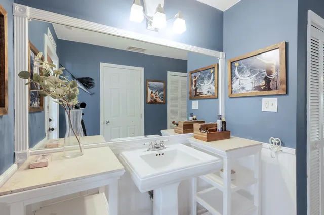 a bed room with a bed and a chair