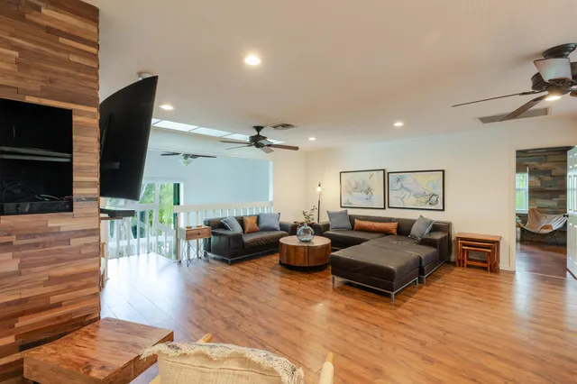 a view of an entryway with wooden floor and windows