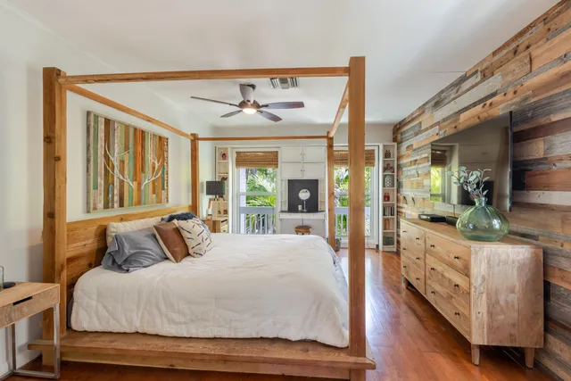 a view of a lake with a bench and trees around
