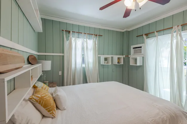 a view of a hallway with a livingroom and a dinning room