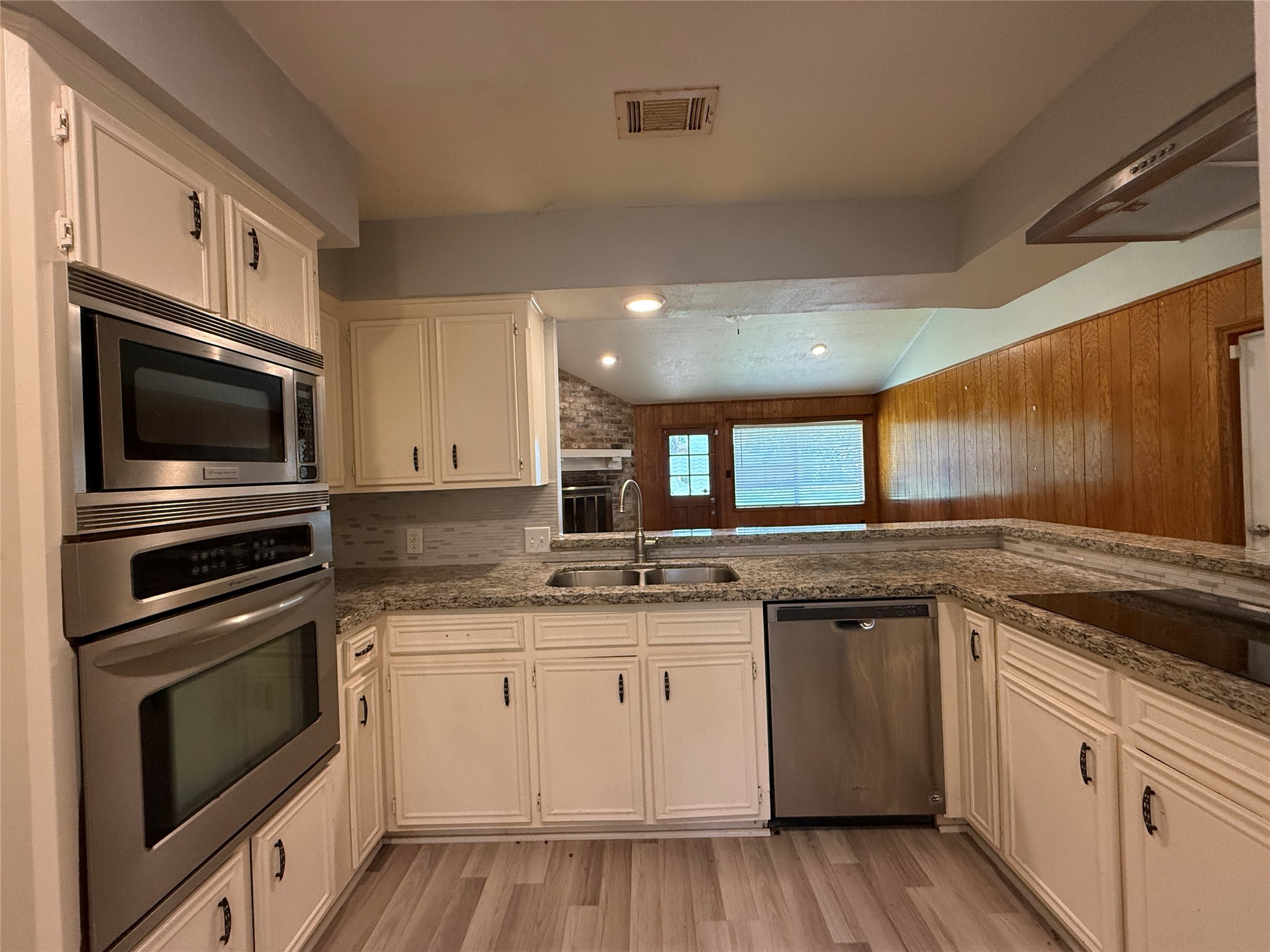 422 Gamewood Drive Spring, TX 77386 - Photo 15 of 25 a kitchen with granite countertop stainless steel appliances and white cabinets