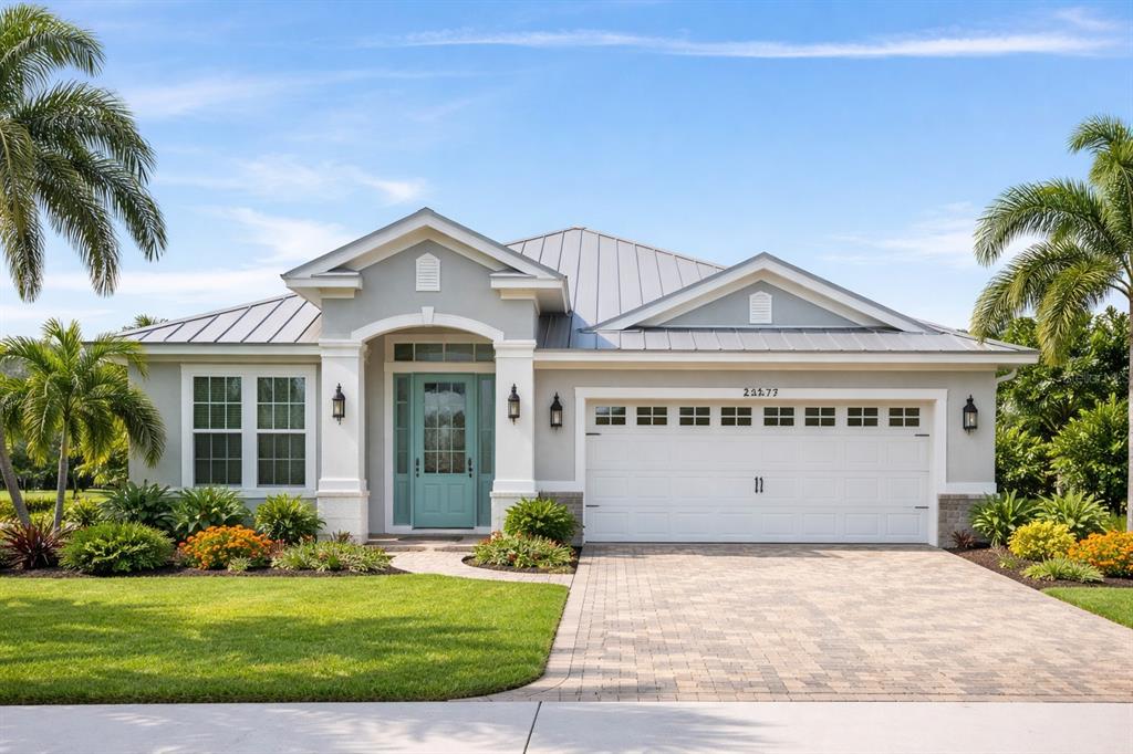 a front view of a house with a yard and garage