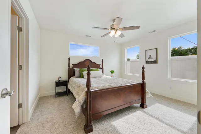 a bed room with a bed and a chandelier