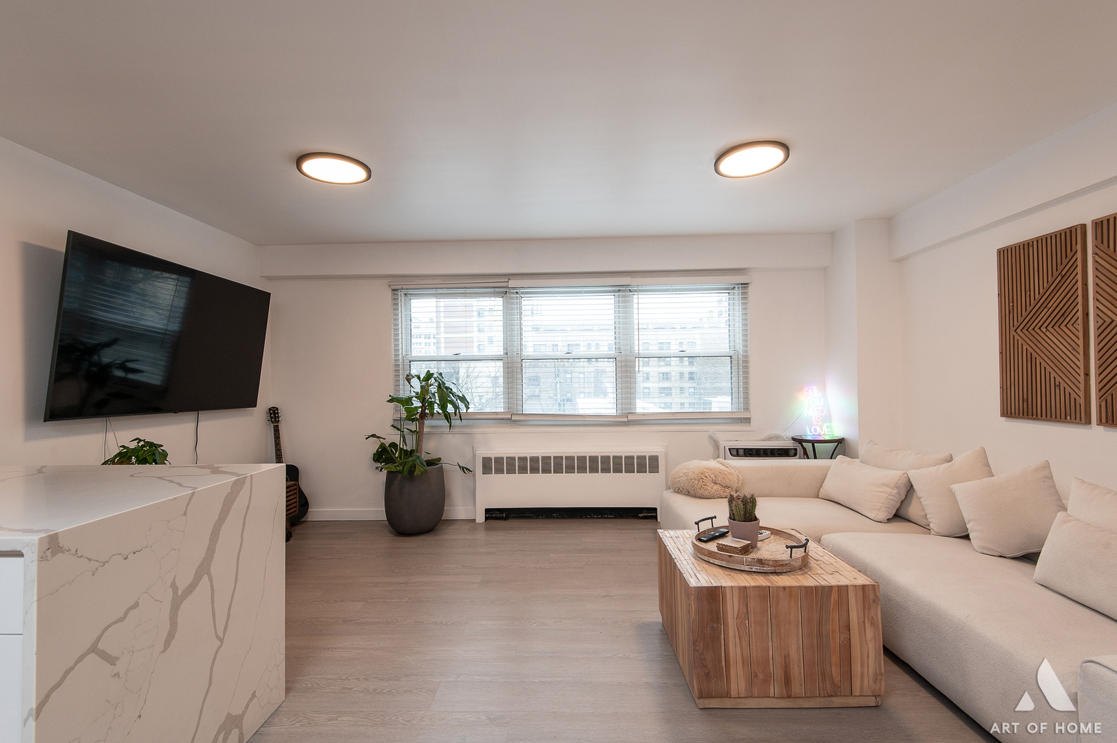 2909 North Sheridan Road, Unit 407 Chicago, IL 60657 - Photo 12 of 20 a living room with furniture and a flat screen tv