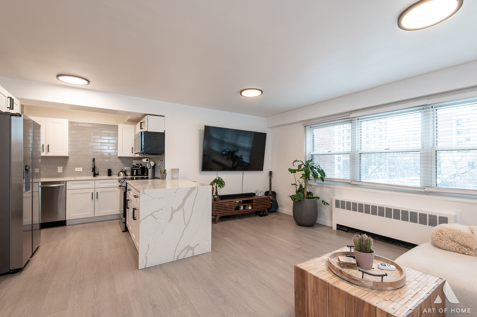 2909 North Sheridan Road, Unit 407 Chicago, IL 60657 - Photo 3 of 20 a living room with furniture and a flat screen tv