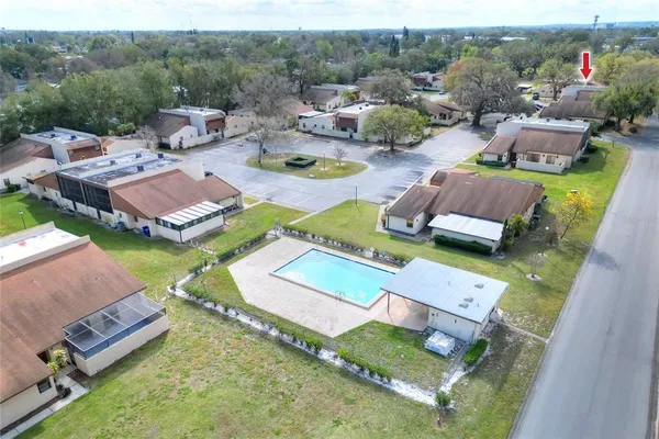 an aerial view of residential houses with outdoor space