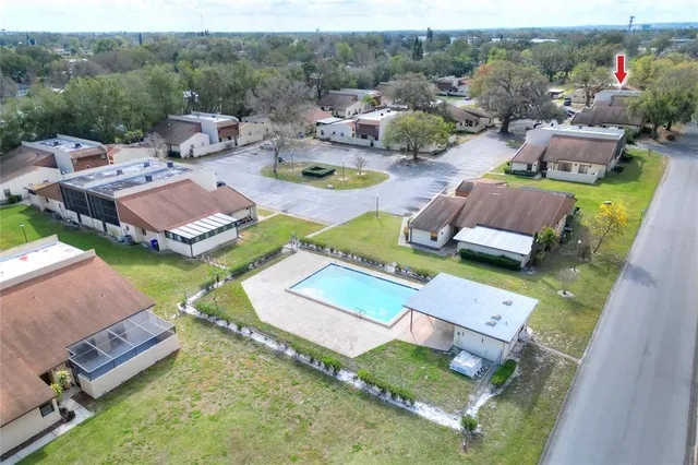 an aerial view of residential houses with outdoor space