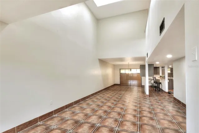a view of a hallway with a kitchen