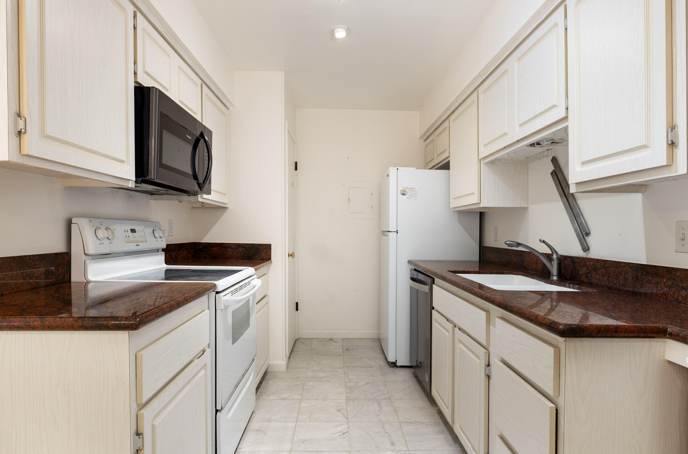 29 Dearborn Place, Unit 7 Goleta, CA 93117 - Photo 11 of 25 a kitchen with stainless steel appliances granite countertop a sink stove and refrigerator