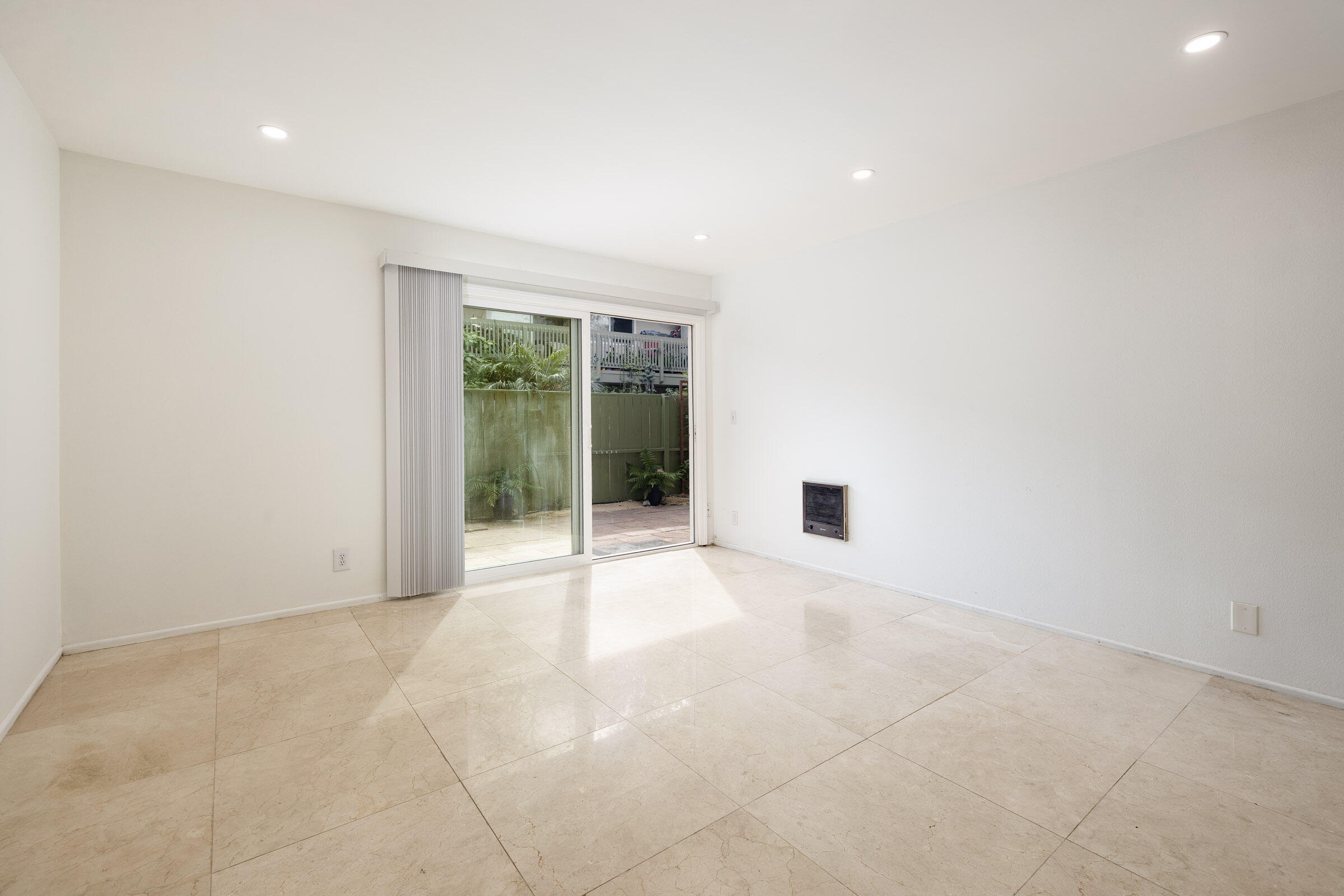 29 Dearborn Place, Unit 7 Goleta, CA 93117 - Photo 4 of 25 a view of an empty room with glass door