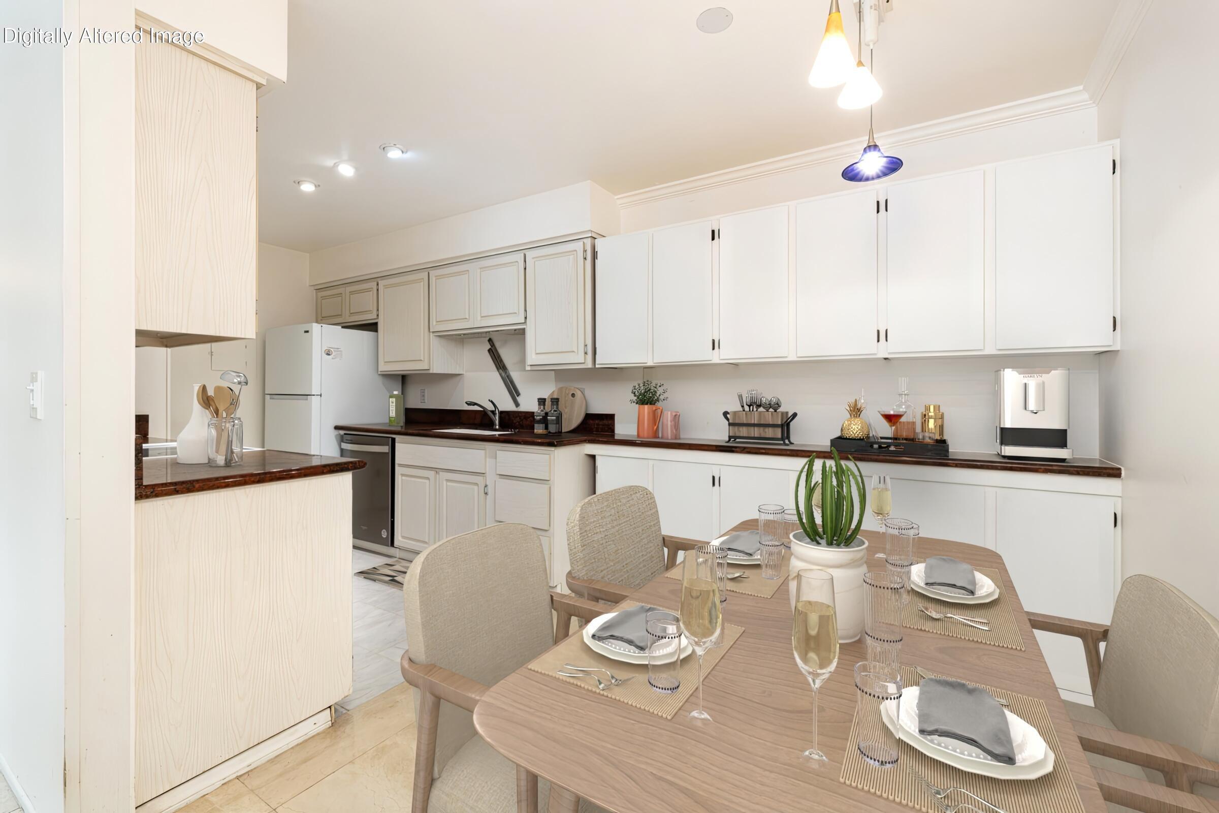 29 Dearborn Place, Unit 7 Goleta, CA 93117 - Photo 9 of 25 a kitchen with dining table stainless steel appliances and cabinets