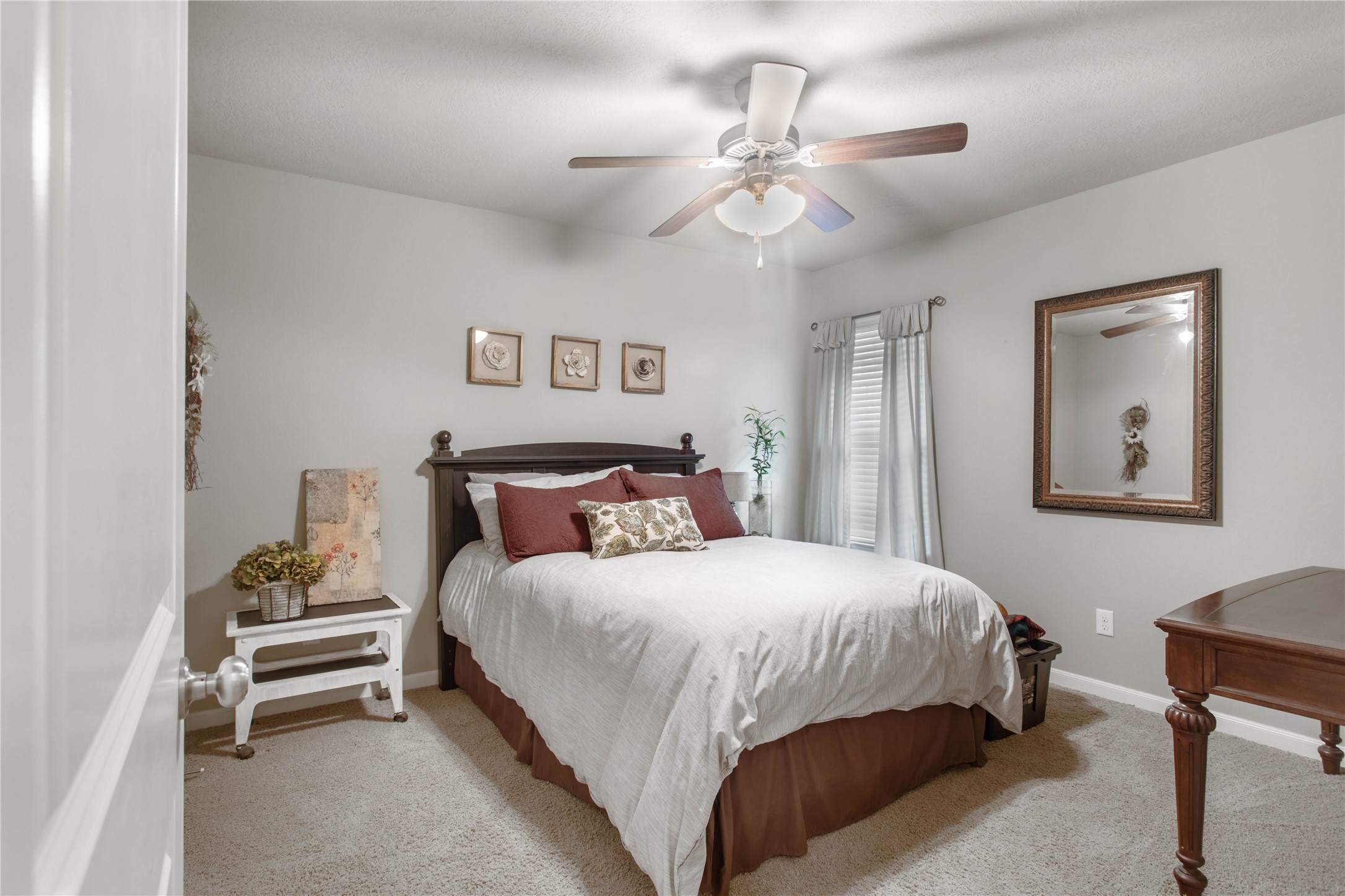 15416 Baker Meadow Loop College Station, TX 77845 - Photo 11 of 26 a bedroom with a bed and a chandelier