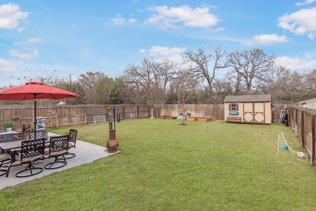 15416 Baker Meadow Loop College Station, TX 77845 - Photo 18 of 26 a view of a house with backyard and sitting area