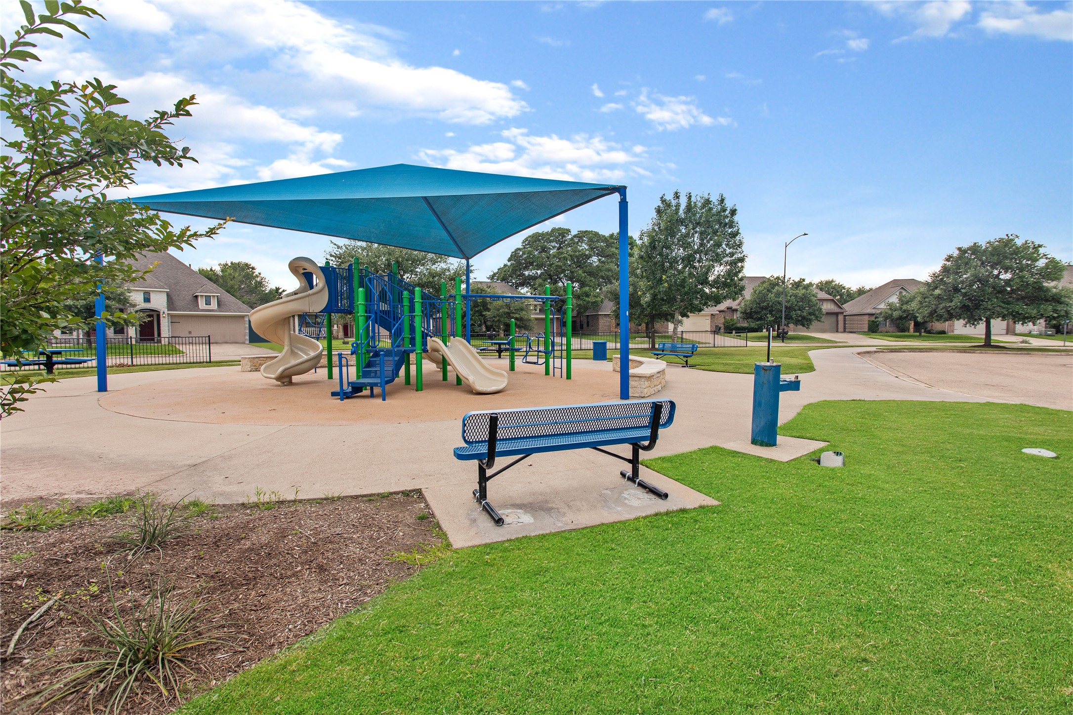 15416 Baker Meadow Loop College Station, TX 77845 - Photo 25 of 26 a park with lots of green space and bench
