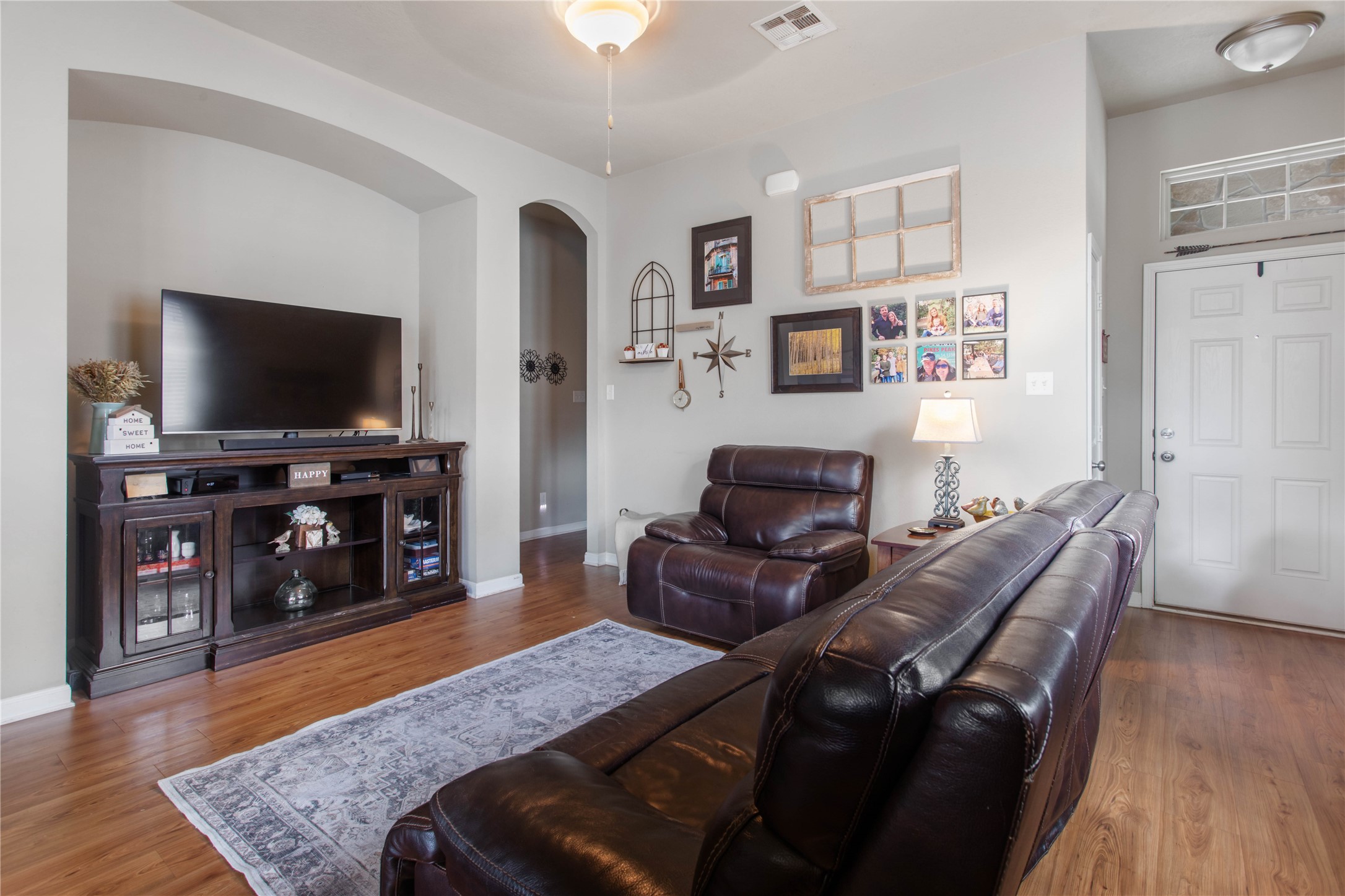 15416 Baker Meadow Loop College Station, TX 77845 - Photo 5 of 26 a living room with furniture and a flat screen tv
