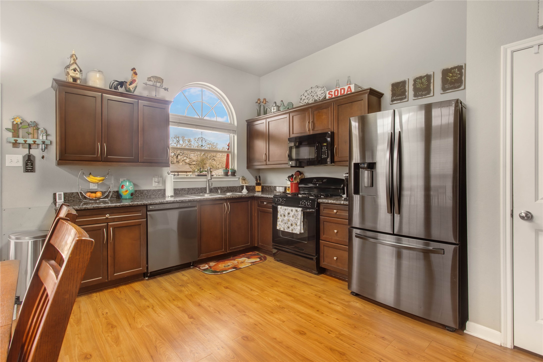 15416 Baker Meadow Loop College Station, TX 77845 - Photo 7 of 26 a kitchen with granite countertop a refrigerator stove top oven and sink