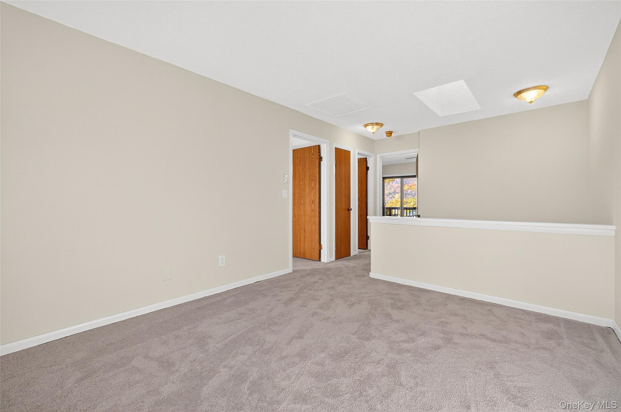 28 Hudson Heights Drive, Unit 28 Poughkeepsie, NY 12601 - Photo 12 of 50 a view of an empty room with closet and a window