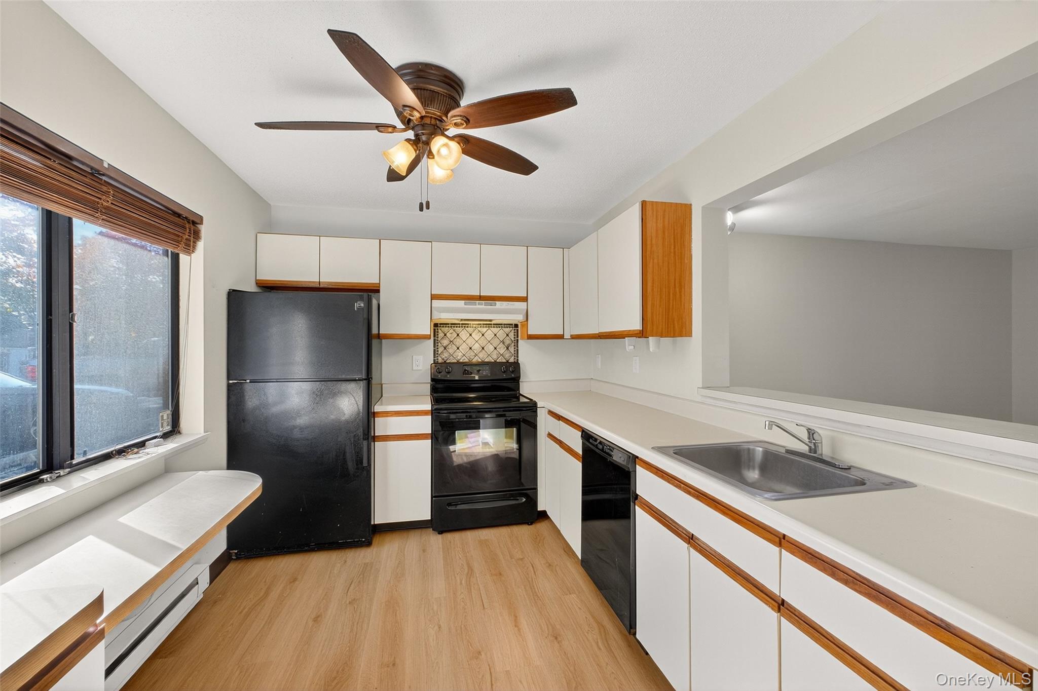 28 Hudson Heights Drive, Unit 28 Poughkeepsie, NY 12601 - Photo 15 of 50 a kitchen with a sink stainless steel appliances and a window