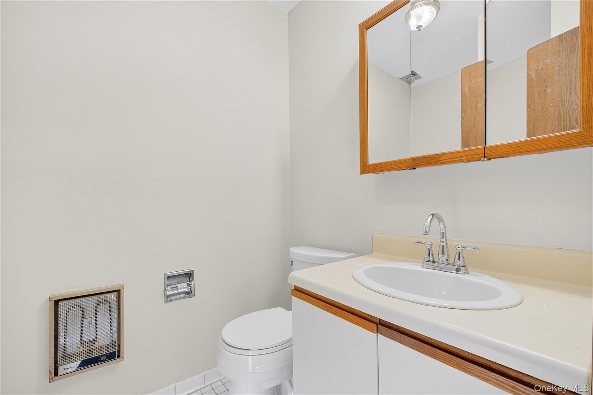 28 Hudson Heights Drive, Unit 28 Poughkeepsie, NY 12601 - Photo 19 of 50 a bathroom with a sink and a toilet