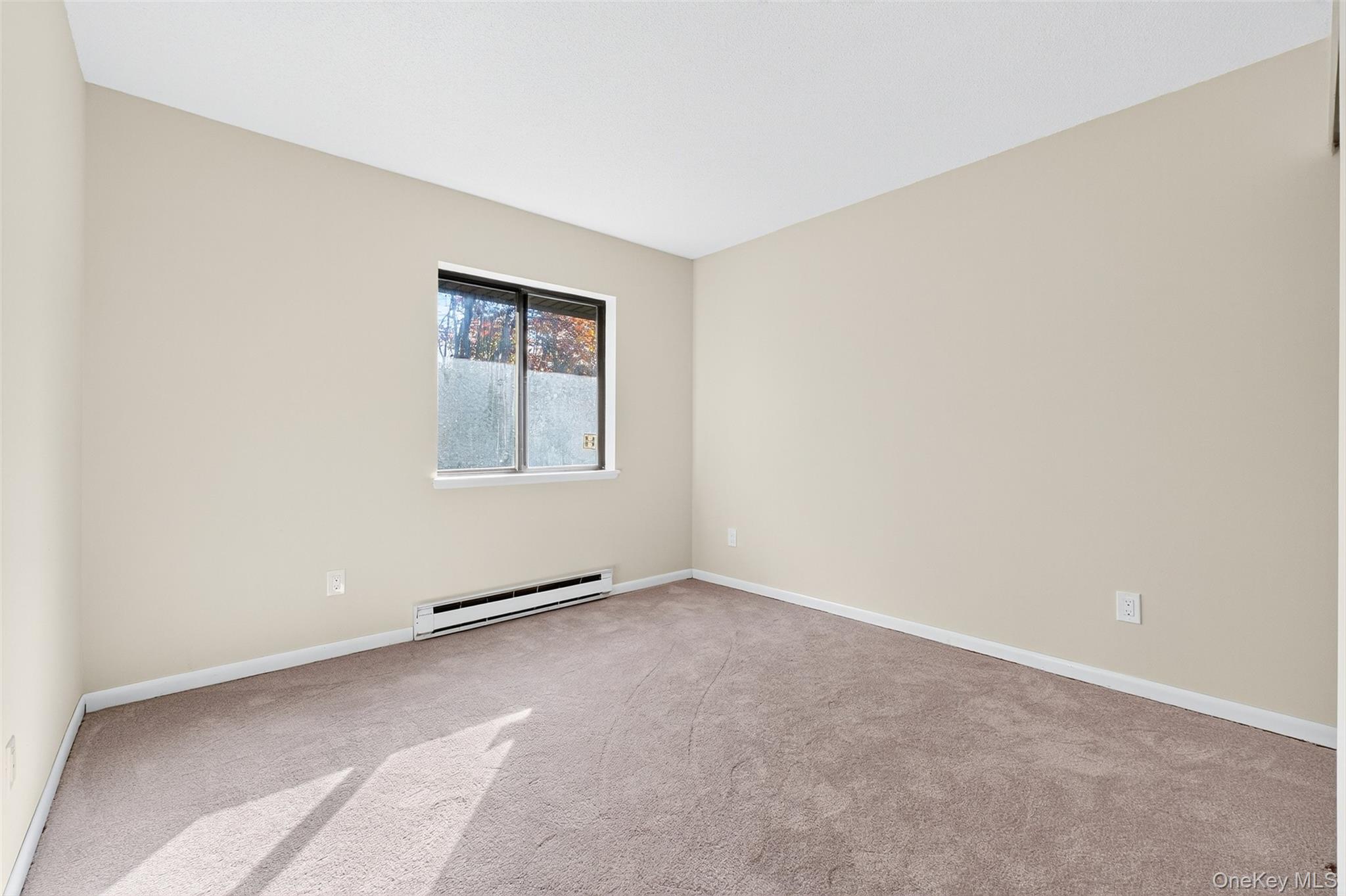 28 Hudson Heights Drive, Unit 28 Poughkeepsie, NY 12601 - Photo 23 of 50 an empty room with windows