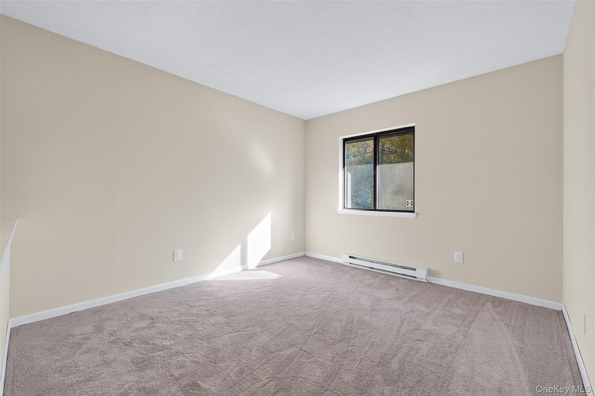28 Hudson Heights Drive, Unit 28 Poughkeepsie, NY 12601 - Photo 24 of 50 an empty room with a window