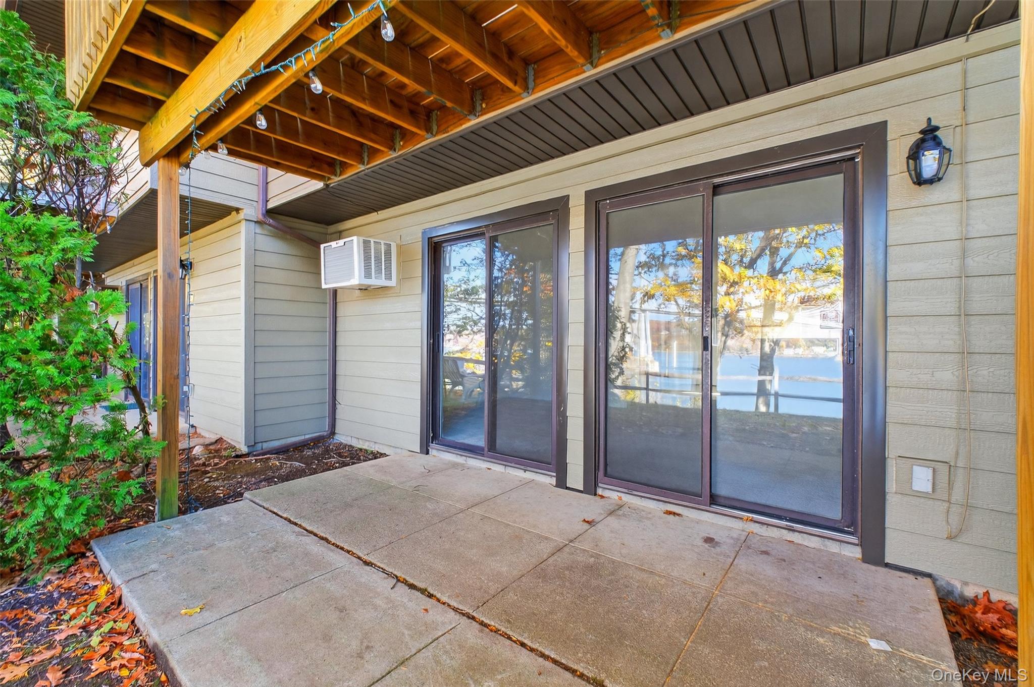 28 Hudson Heights Drive, Unit 28 Poughkeepsie, NY 12601 - Photo 33 of 50 a view of backyard with large windows and plants