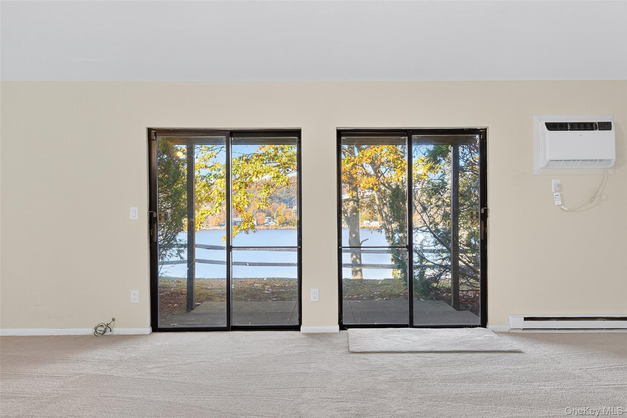 28 Hudson Heights Drive, Unit 28 Poughkeepsie, NY 12601 - Photo 8 of 50 a view of an empty room with glass windows