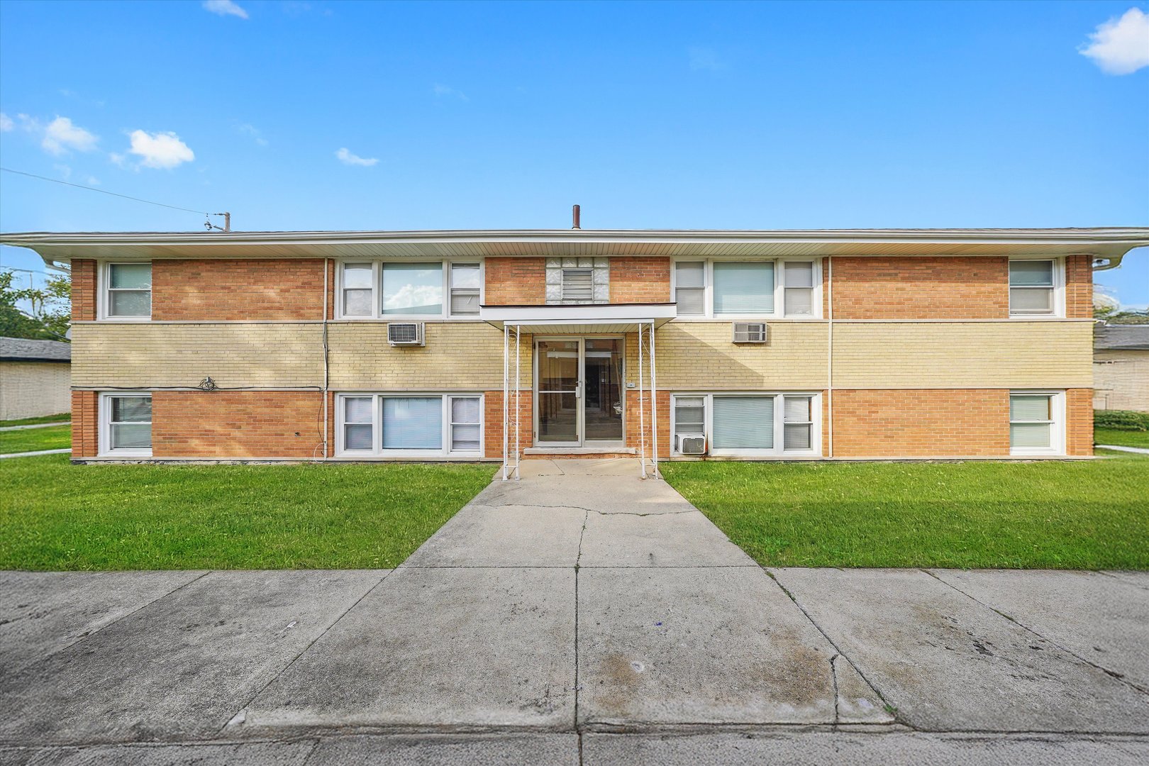 18508 Torrence Avenue Lansing, IL 60438 - Photo 1 of 39 front view of a house and a yard
