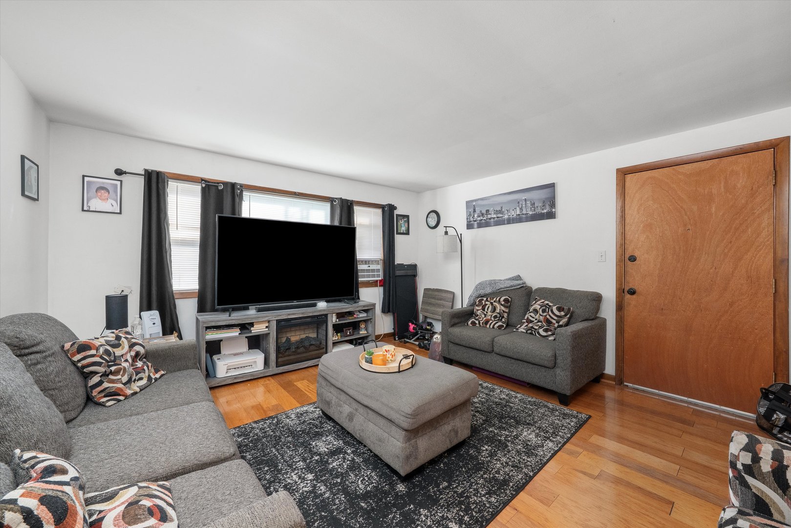 18508 Torrence Avenue Lansing, IL 60438 - Photo 15 of 39 a living room with furniture and a flat screen tv