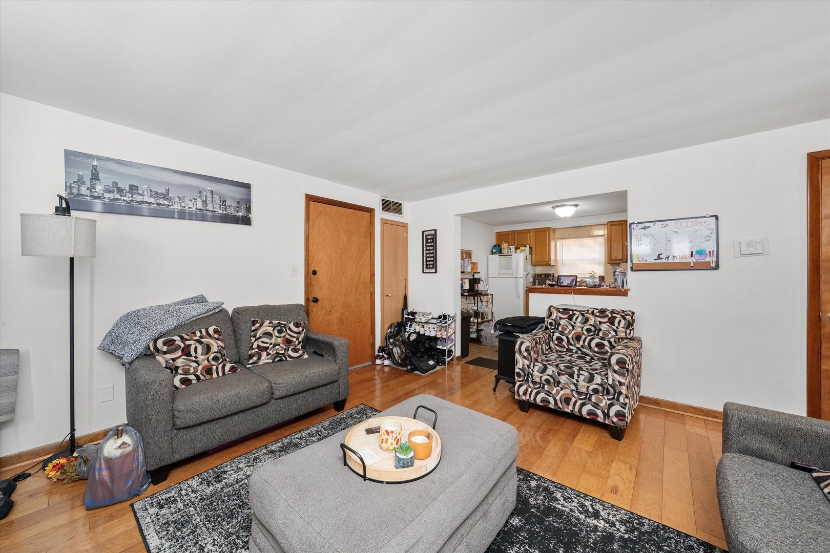18508 Torrence Avenue Lansing, IL 60438 - Photo 17 of 39 a living room with furniture and wooden floor