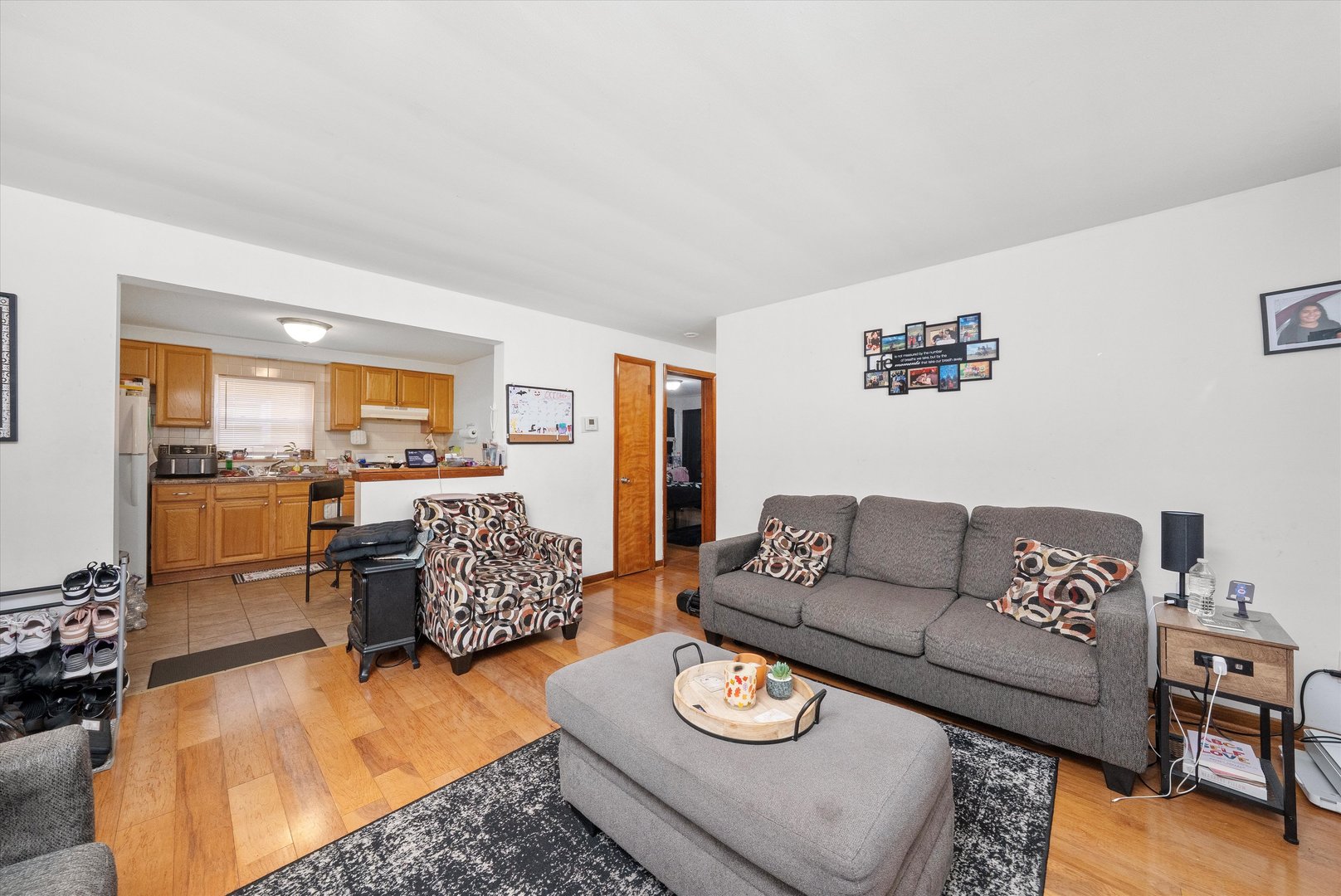18508 Torrence Avenue Lansing, IL 60438 - Photo 18 of 39 a living room with furniture and a wooden floor