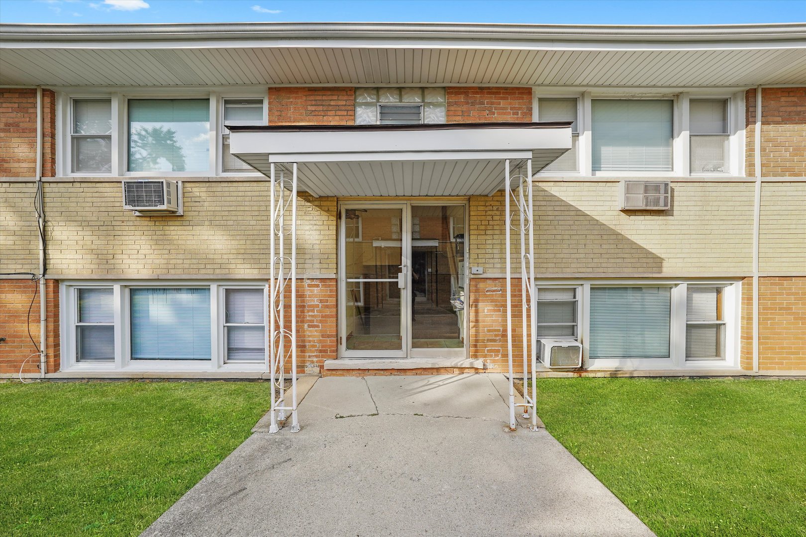 18508 Torrence Avenue Lansing, IL 60438 - Photo 2 of 39 a view of a house with a large window and a yard