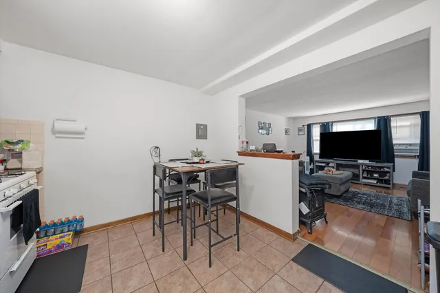 a view of a livingroom with furniture and a flat screen tv