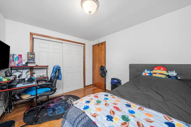 a bedroom with bed and a window