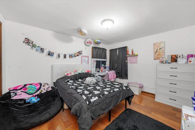 a bed room with a bed and a dresser