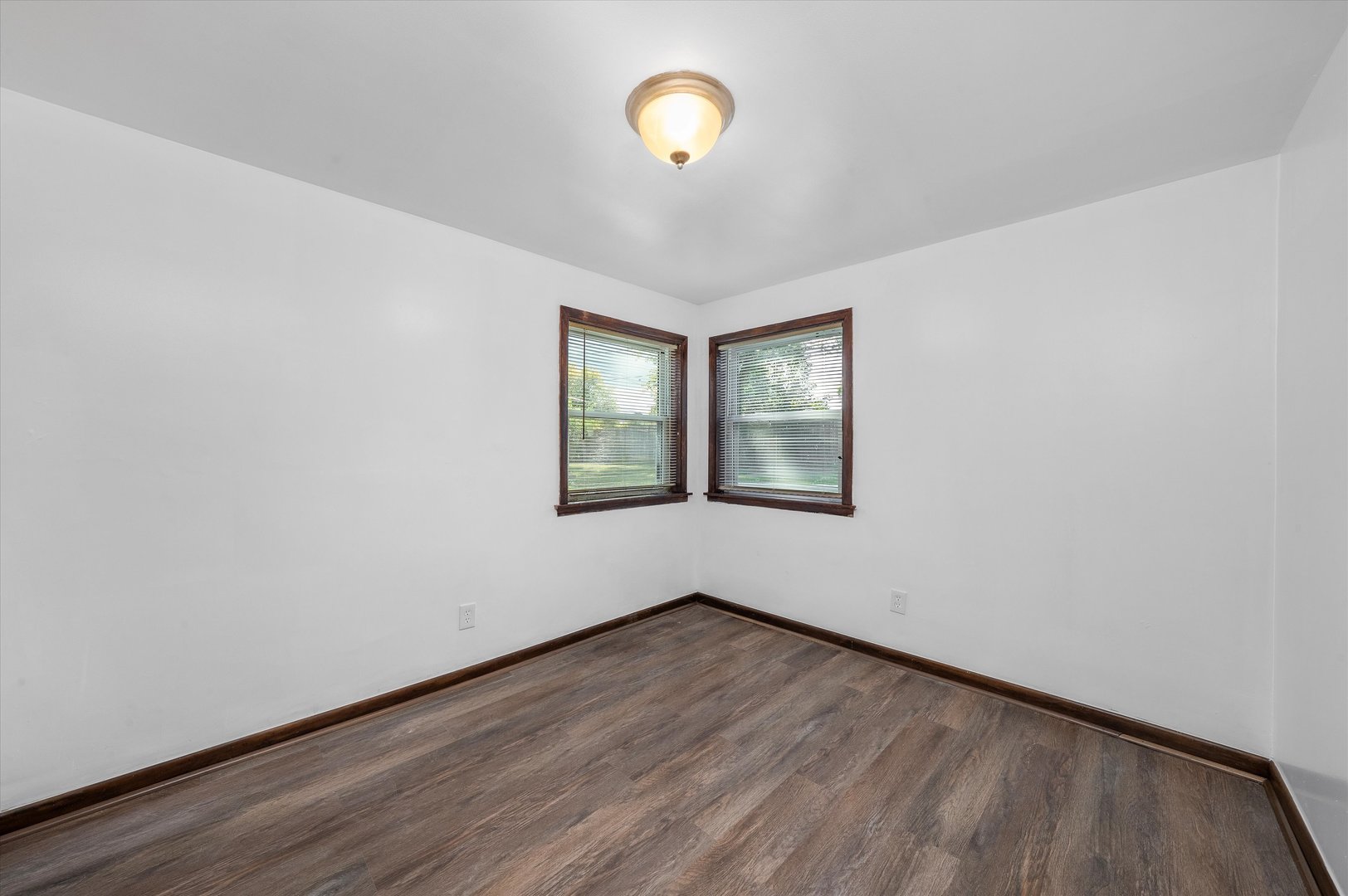 18508 Torrence Avenue Lansing, IL 60438 - Photo 9 of 39 an empty room with wooden floor and windows