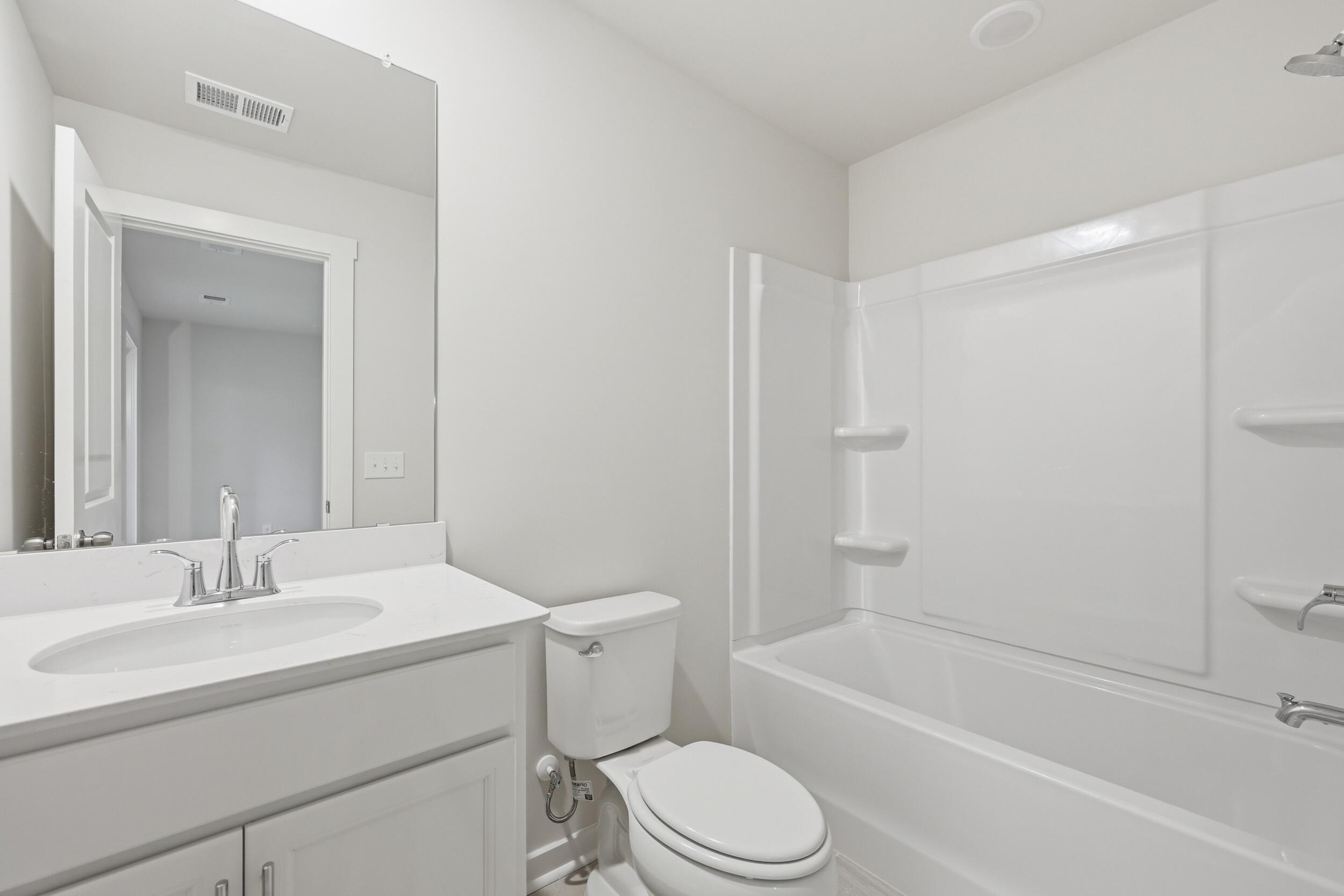 128 Fernbank Road Johns Island, SC 29455 - Photo 6 of 26 1st floor BR w/ ensuite bathroom
