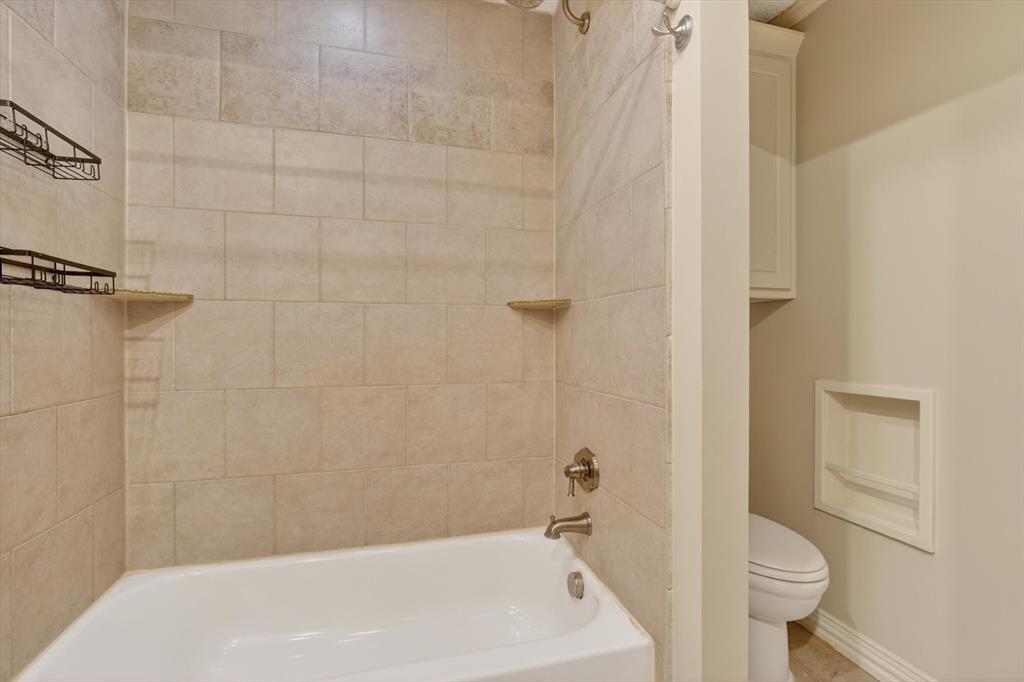 272 Lodge Road Coppell, TX 75019 - Photo 17 of 24 a bathroom with a sink and a toilet