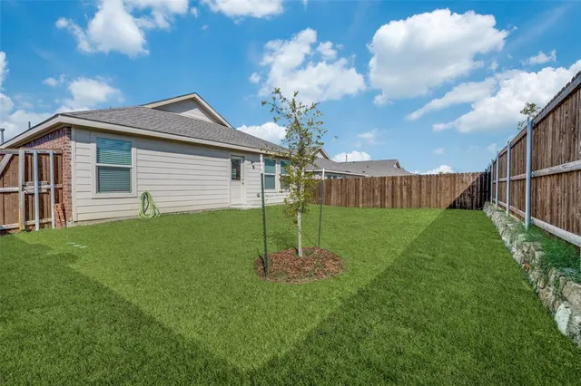 a house view with a garden space