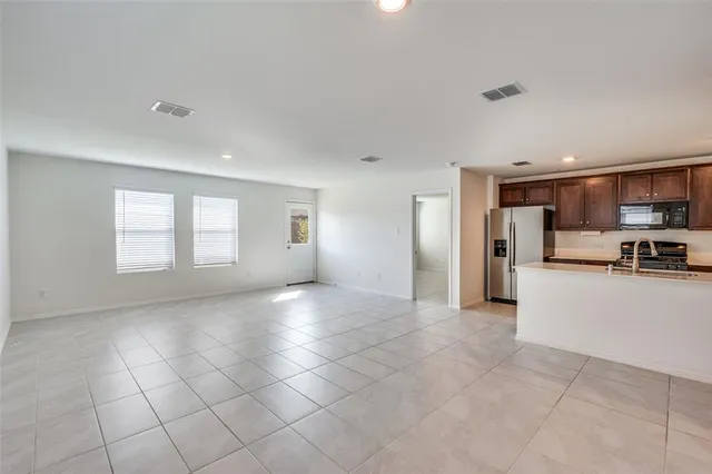 a view of a kitchen with a sink and a window
