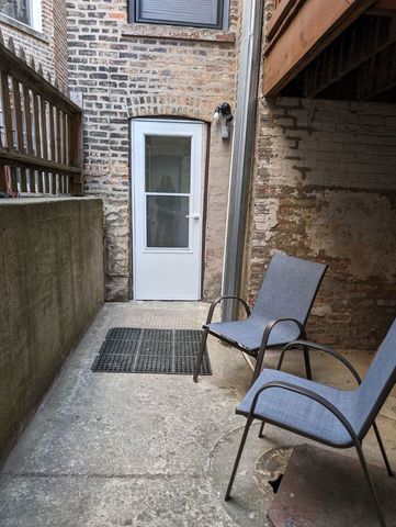 a front view of a house with outdoor seating