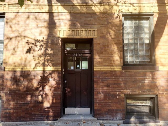 a view of a brick building with brick walls