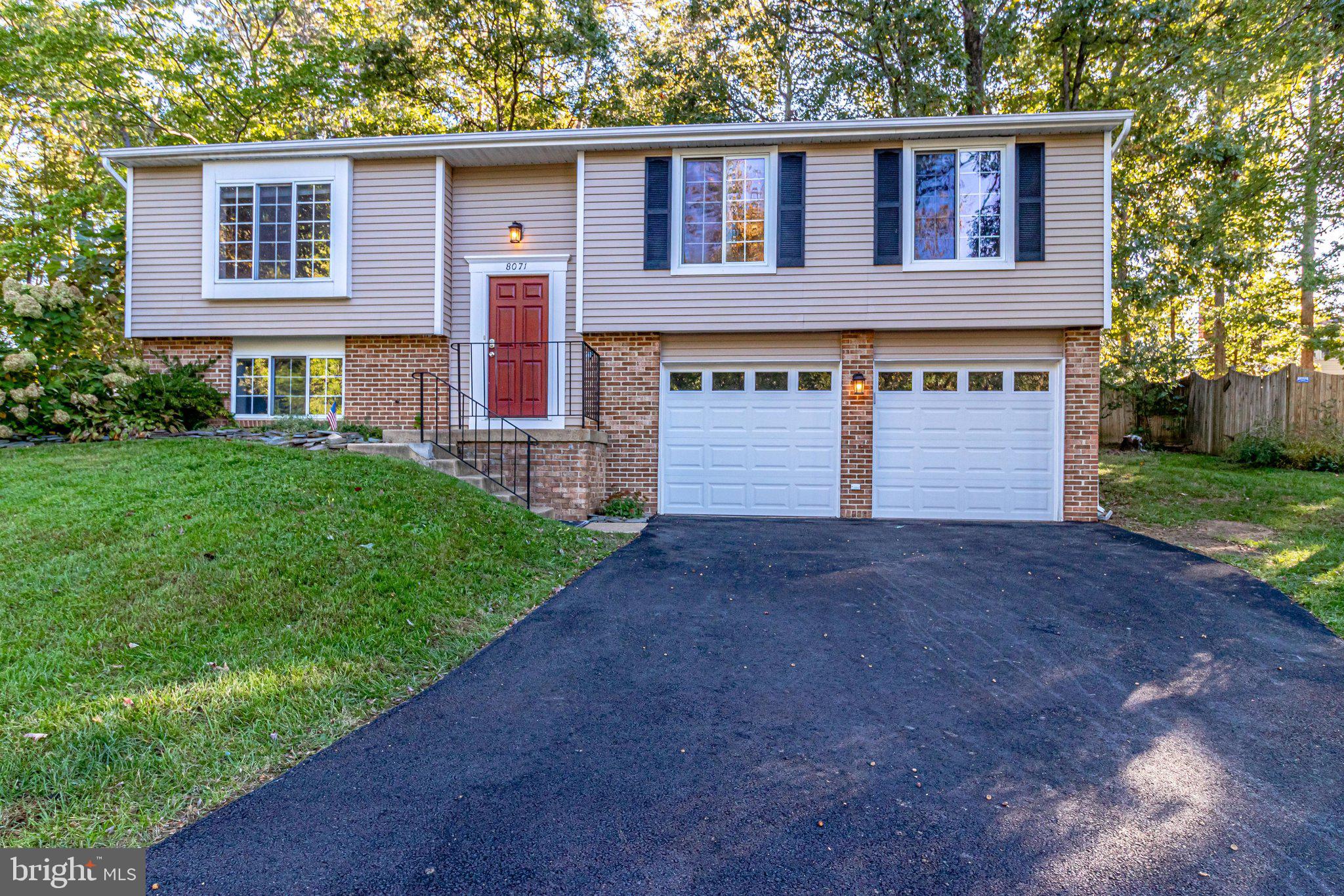 Spacious Driveway & 2-Car Garage