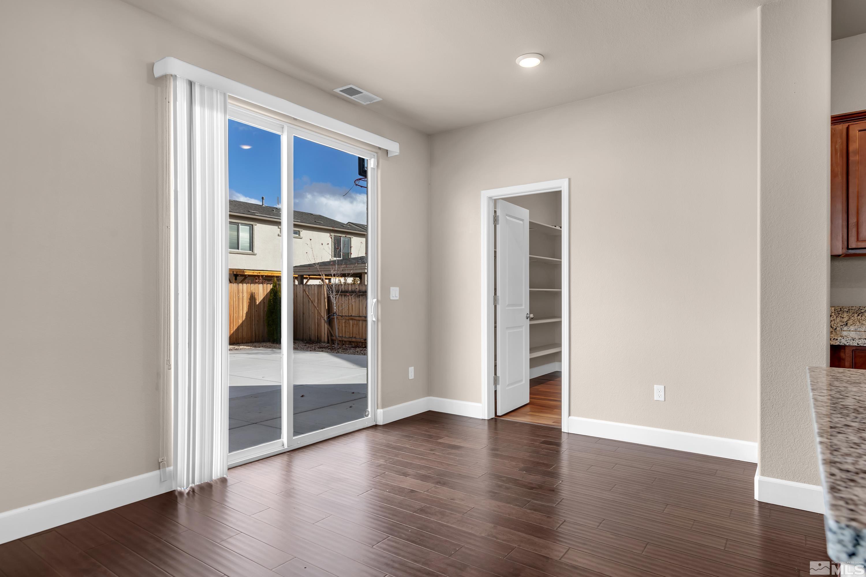 9352 Bay Drive Reno, NV 89506 - Photo 4 of 37 an empty room with wooden floor and closet