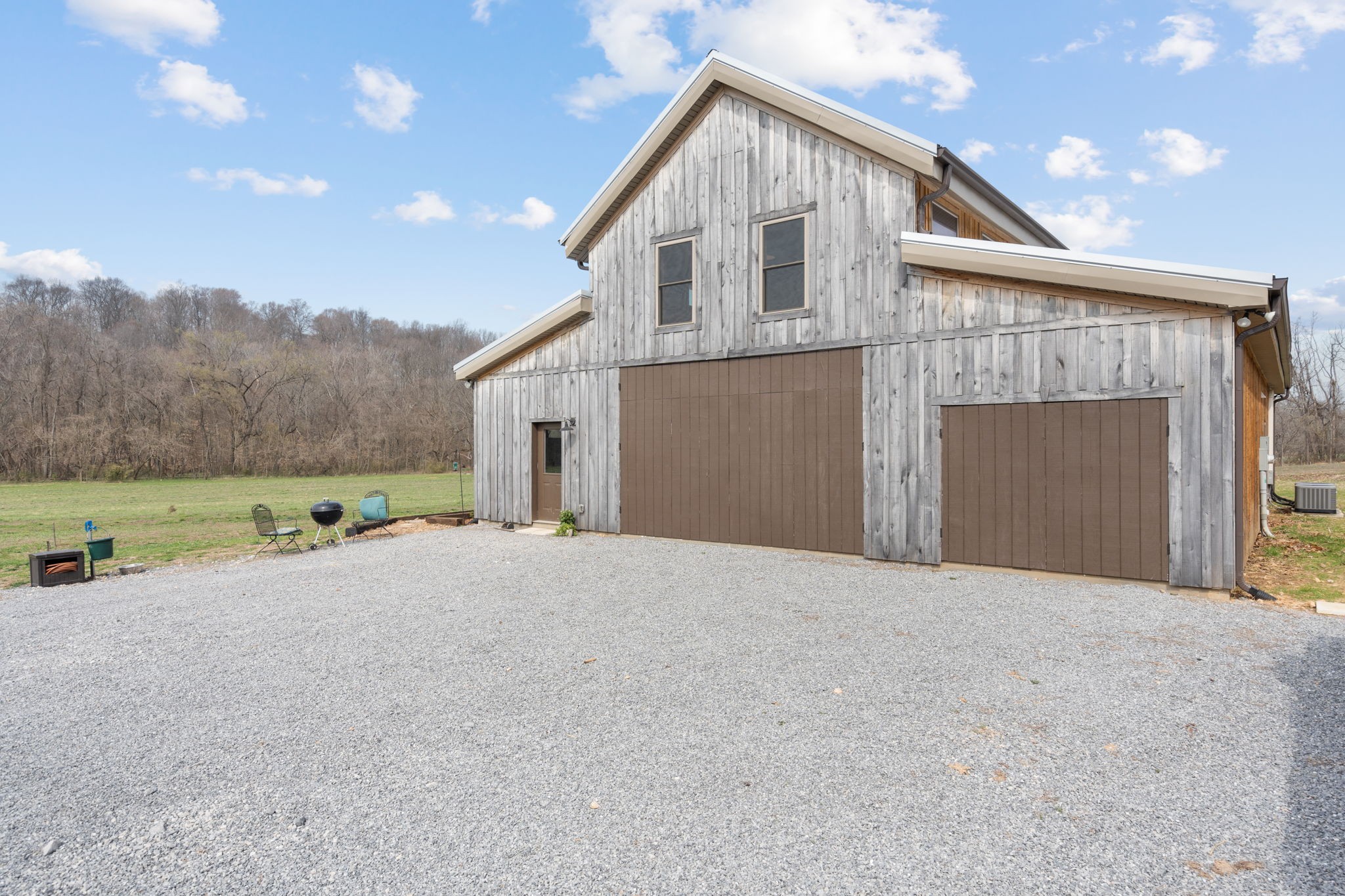 6292 Roy Pearson Road Springfield, TN 37172 - Photo 36 of 49 a front view of a house with a yard and garage