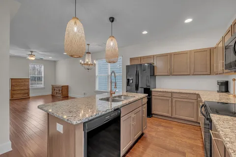 a bathroom with a sink a mirror and shower