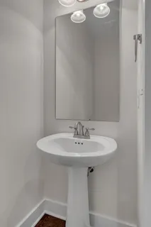 an empty room with a window and a ceiling fan